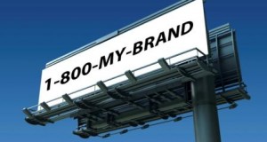 Vanity Number Vanity 800 toll free telephone number on a billboard with blue sky
